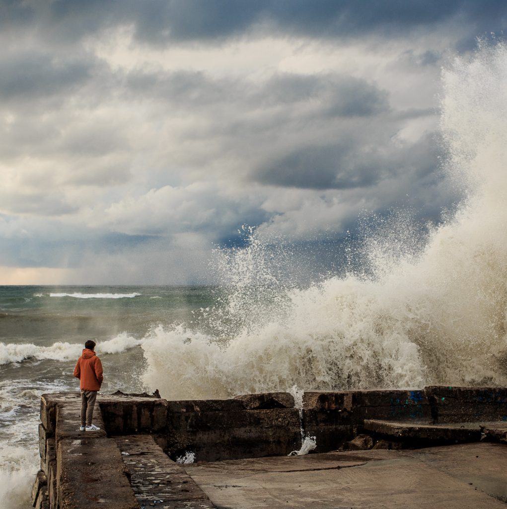 Storm waves over a pier in the Adler, Sochi