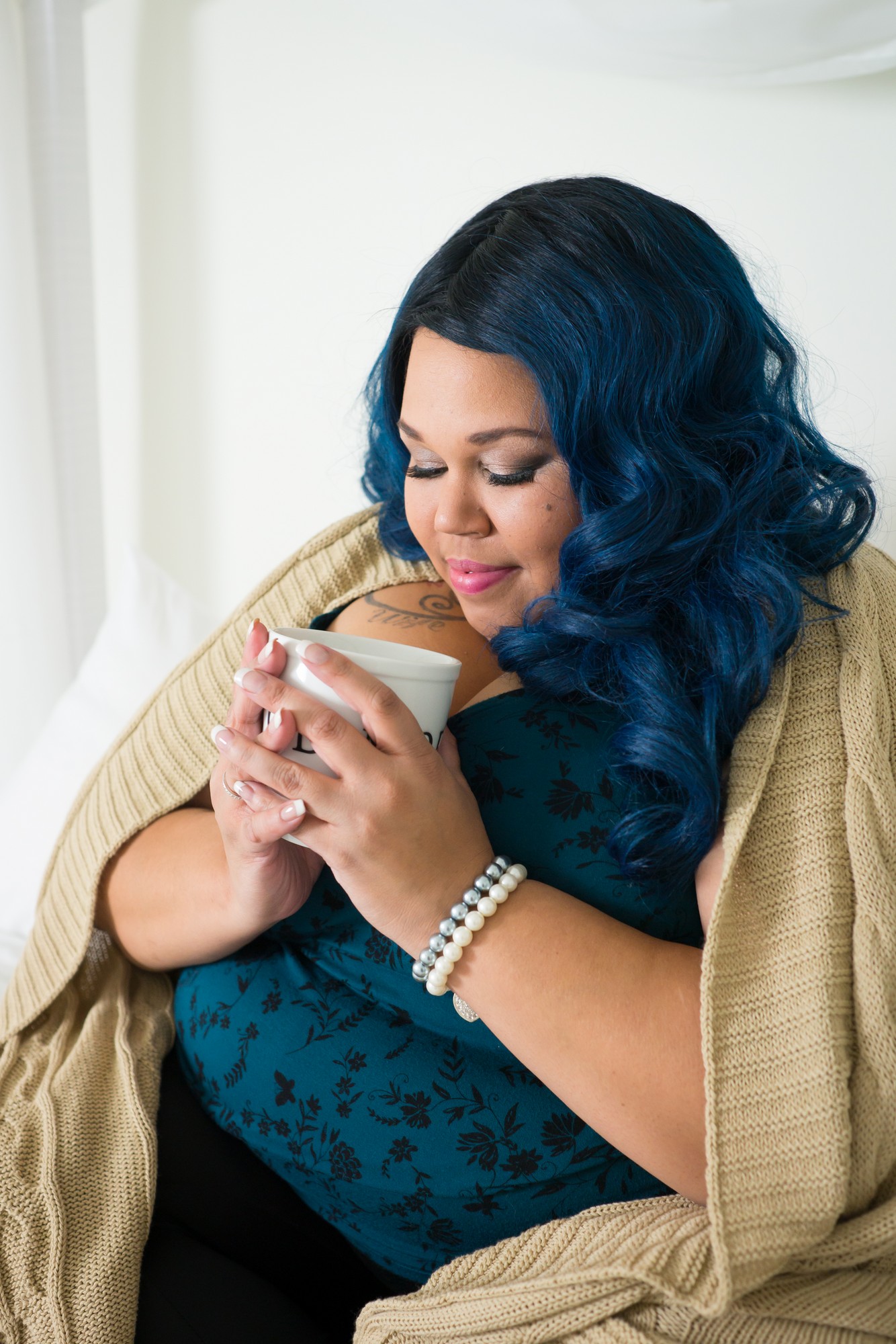 Royalty Free Stock Photo: Plus Size African American Woman Drinks Coffee on Bed